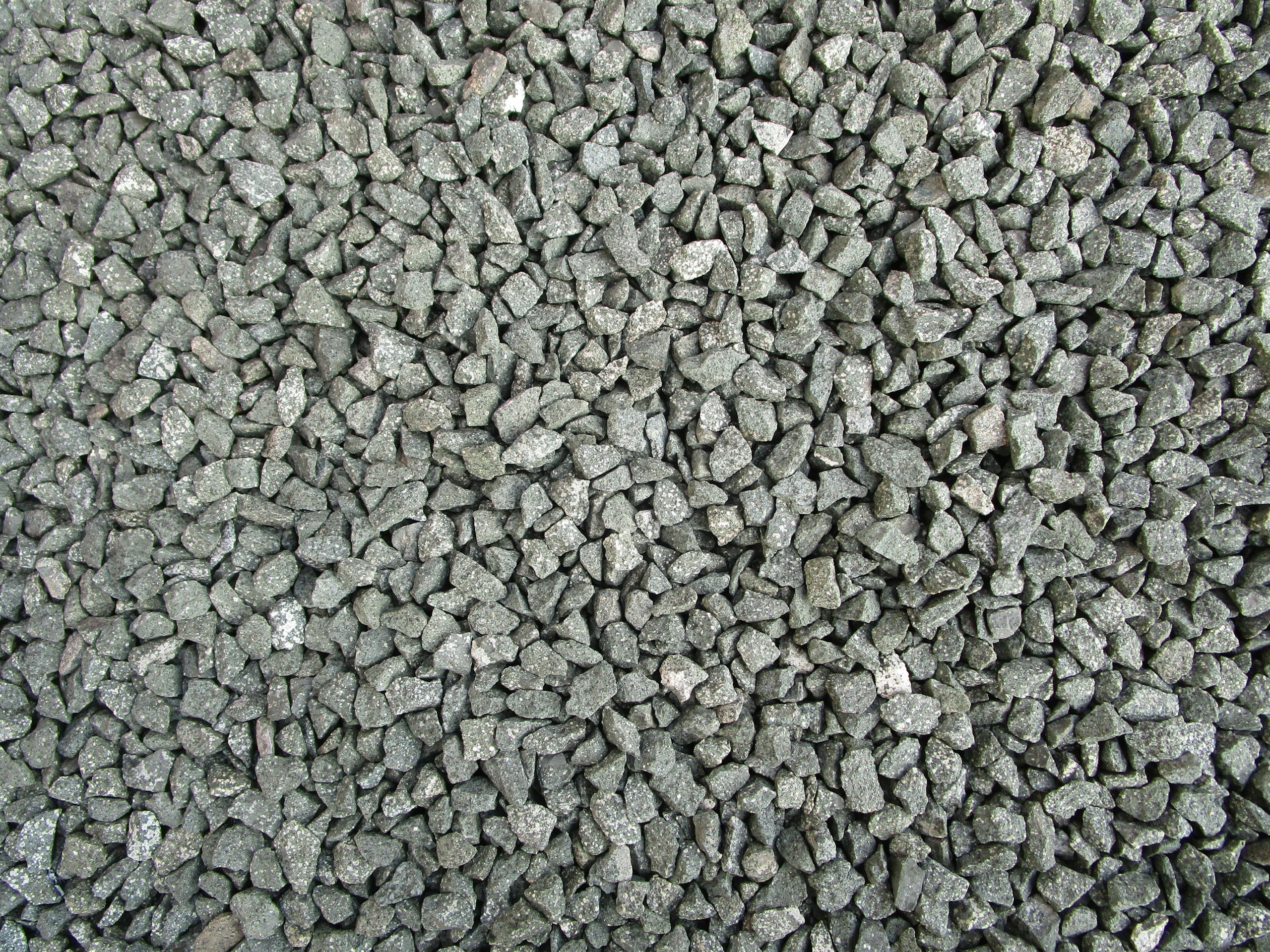 Detailed view of grey gravel stones commonly used in construction and landscaping.